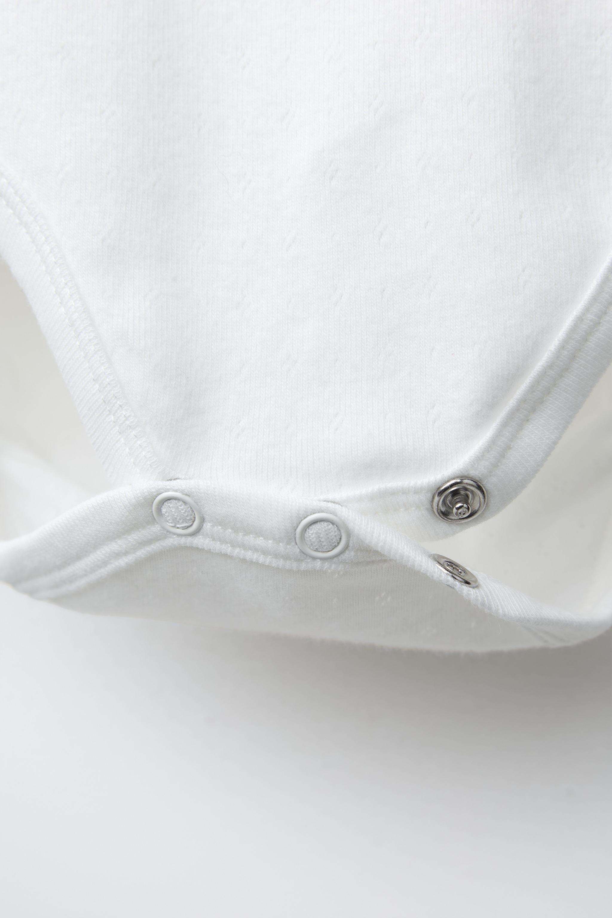 THREE-PACK OF HEART BODYSUITS